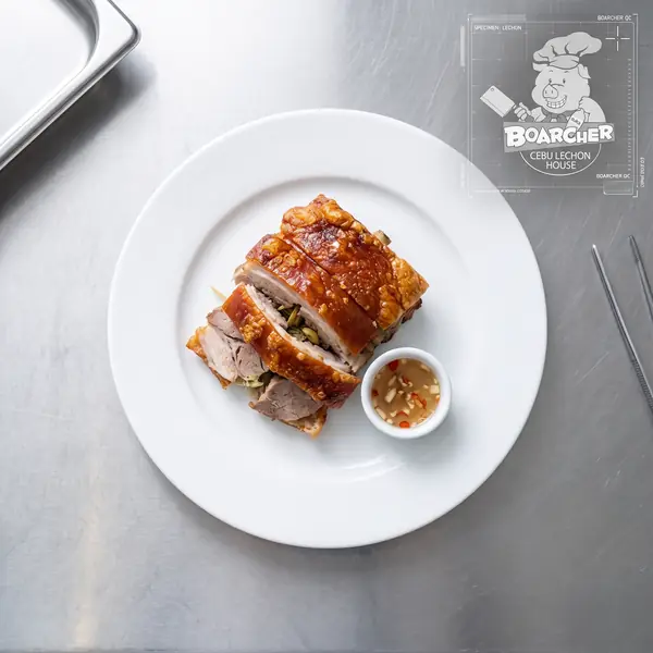 Lechon portion on white plate