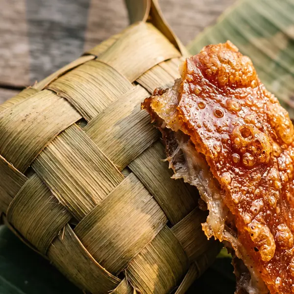 Puso leaf and lechon skin