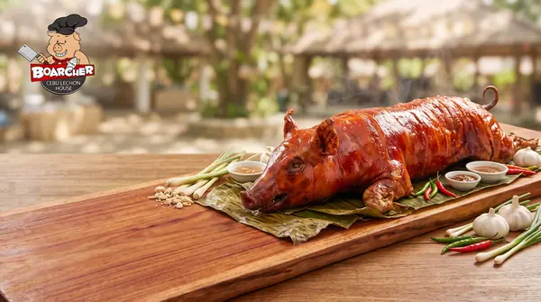 Whole lechon on wood board